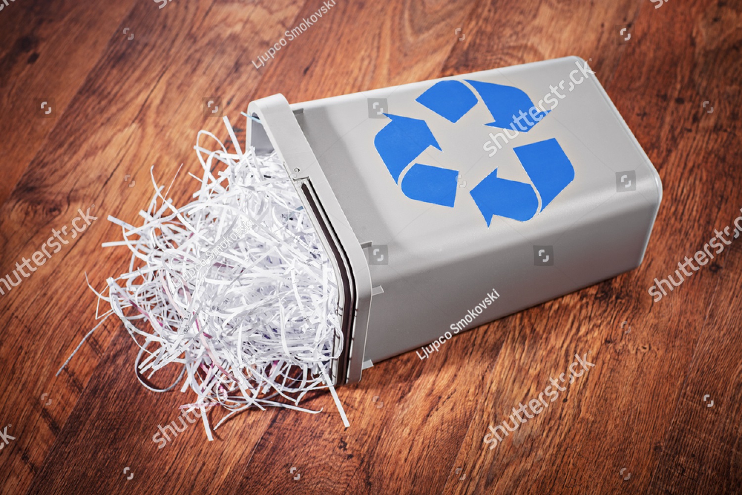 stock-photo-flipped-recycle-bin-full-of-shredded-paper-on-a-wooden-floor-216804766 | Printwaste